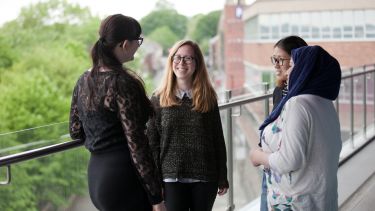 PG Students on balcony of Students Union